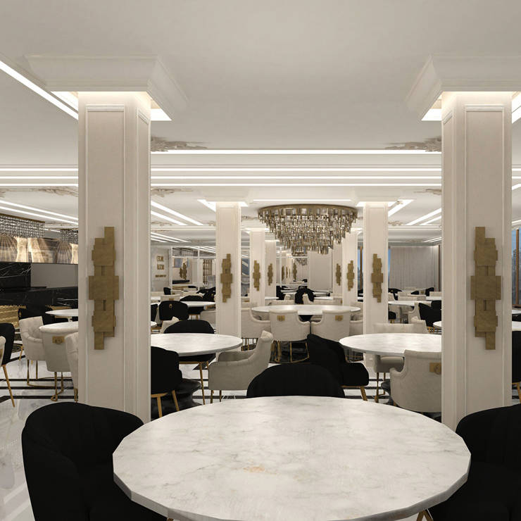 Restaurant interior in Royal Marmin Arachova, with columns, golden accents and luxurious seating