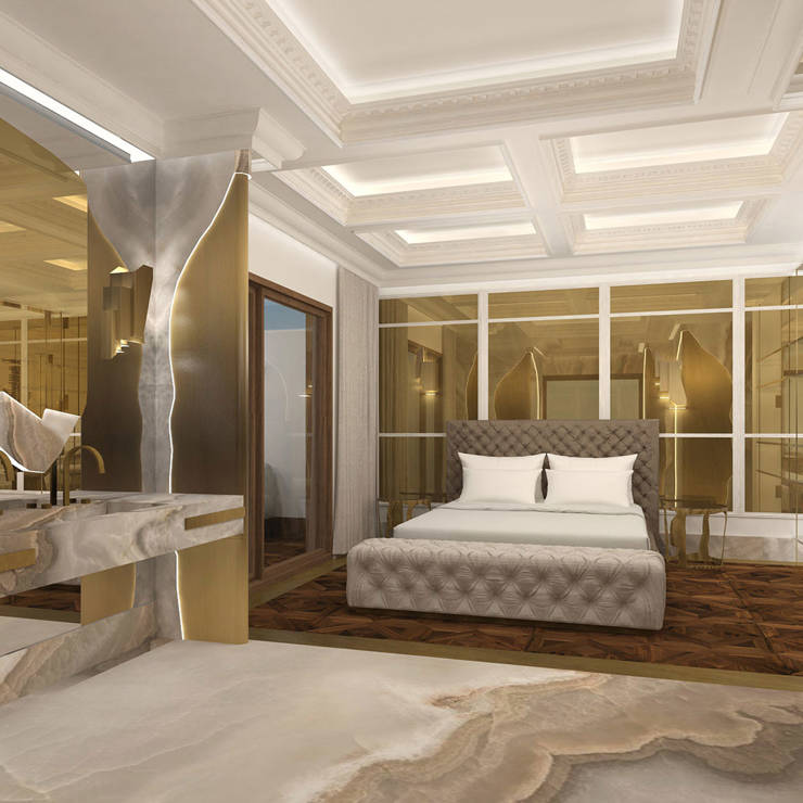 Luxurious bedroom with tufted bed, marble flooring, and golden decorative panels in Royal Golden Suite