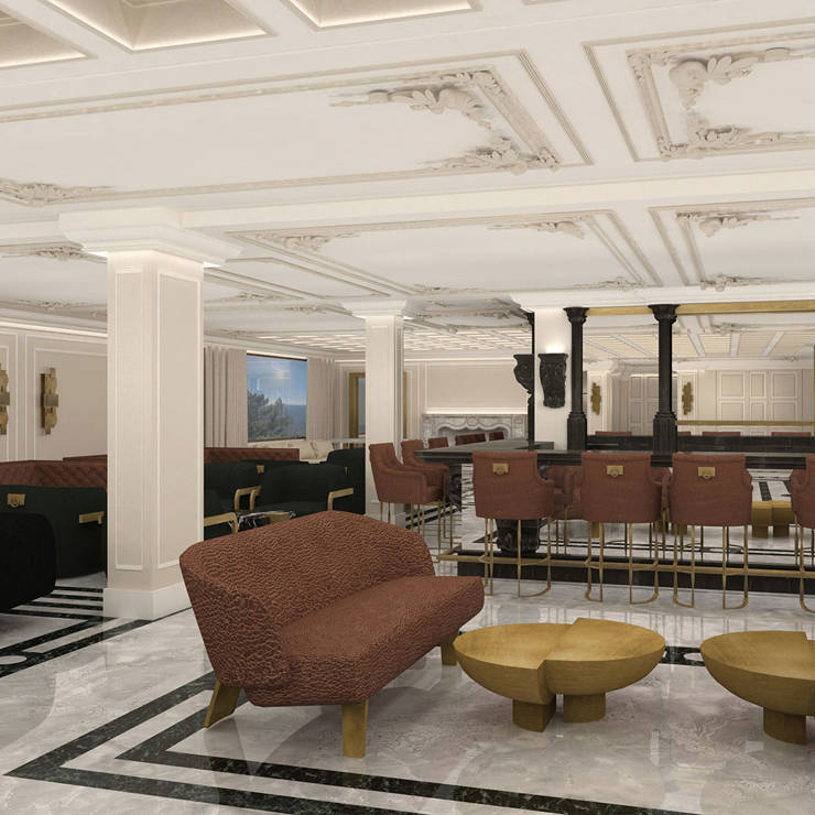 Stylish hotel lobby with marble floors, elegant bar area, and plush brown and black seating in Royal Marmin Arachova