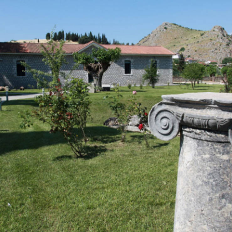 Stone building with garden pathway in village of Chaeronea