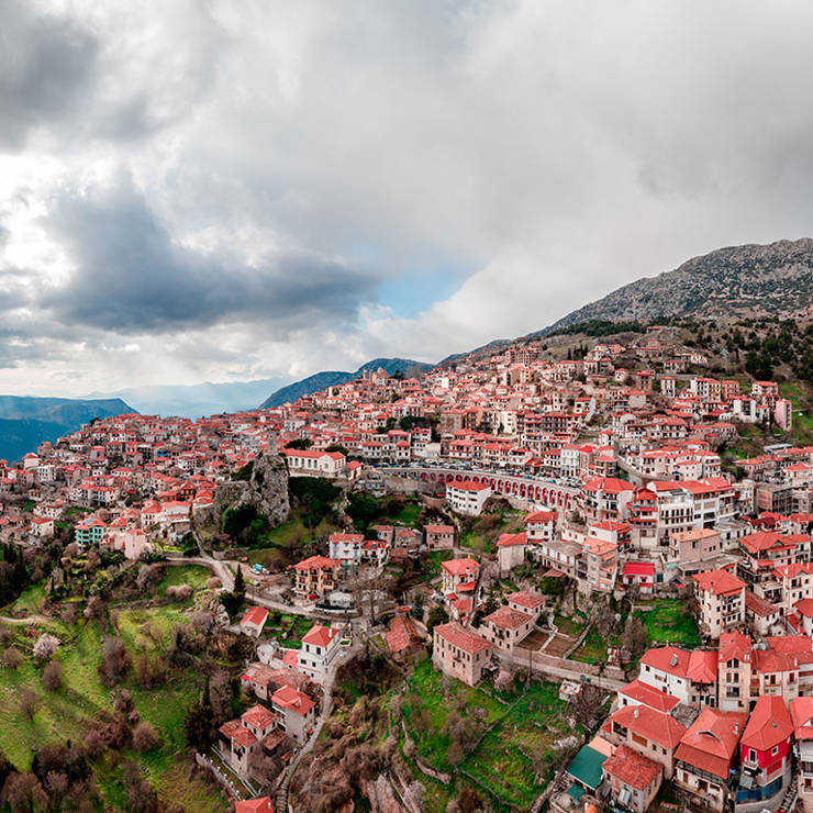 Panoramic aerial view of Arachova village with red-roofed houses on Mount Parnassus